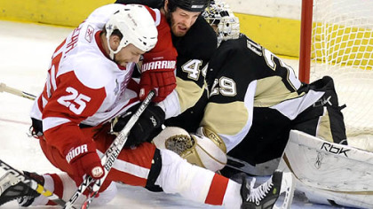 Brooks Orpik takes on Detroit's Darren McCarty in front of goalie Marc-Andre Fleury in Game 4 of the Stanley Cup final. Orpik appears to be 1 or 1A on GM Ray Shero's wish list.