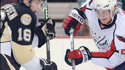 The Capitals' Jeff Schultz dribbles the puck on his stick in the second period against the Penguins. Ovechkin had three points on two goals and one assist.