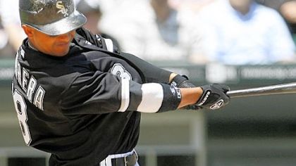 The White Sox's Orlando Cabrera hits a three-run home run against the Pirates in the second inning yesterday in Chicago.