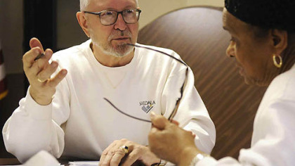 Post-Gazette
Six-year VITA volunteer Ray Koper, left, helps Willa Jones, of Coraopolis, fill out her 2007 federal income tax form at the Coraopolis United Methodist Church.