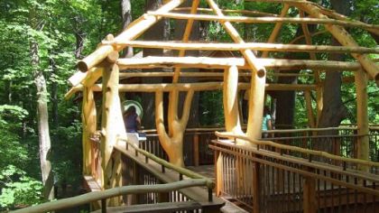 The Adirondack-style Lookout Loft treehouse at Longwood Gardens has two viewing platforms connected by a walkway. Visitors reach it on a long winding ramp that is handicapped-accessible.
