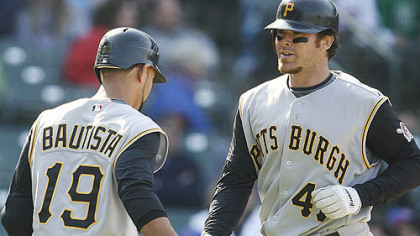 The Pirates' Ryan Doumit celebrates with Jose Bautista yesterday after hitting a solo home run.