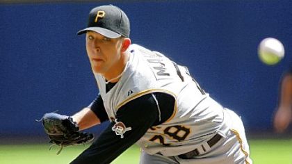 Pirates starter Paul Maholm works to a Milwaukee batter in the first inning yesterday.