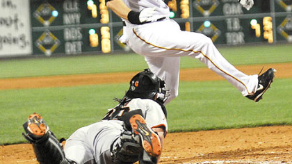 Adam LaRoche eludes the tag of Giants catcher Bengie Molina to extend the Pirates' lead to 10-1 in the seventh inning last night at PNC Park.