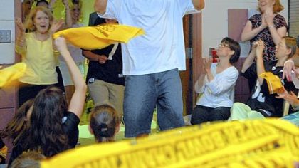 Steelers quarterback Ben Roethlisberger enters the gym of Wyland Elementary School in Hampton to the loud cheers of the students. Students were involved in a fund-raiser selling Ben BBQ sauce and donated $1,000 to Mr. Roethlisberger's favorite charity, the Ronald McDonald House, and also raised money for their PTO.
