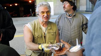 John Heller/Post-Gazette
George Ford, center, who runs Feed My Sheep ministries, distributes sandwiches in Downtown Pittsburgh.