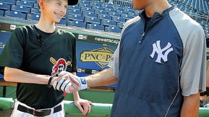 John Challis meets one of his baseball heroes, Yankee shortstop Derek Jeter, at PNC Park in June.
