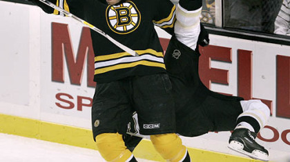 Coach Michel Therrien: "You need breaks to win hockey games, but, when your work ethic is there, that is when you get more breaks. I don't think the work ethic was 100 percent there [Thursday night], and we didn't get any breaks."  Above, Boston Bruins left wing Milan Lucic, left, upends Penguins defenseman Sergei Gonchar during the first period.