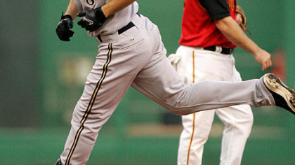 Brewers' Ryan Braun, left, rounds the bases past  shortstop Jack Wilson after hitting a three-run first inning homer off pitcher Tom Gorzelanny in a baseball game at PNC Park last night.
