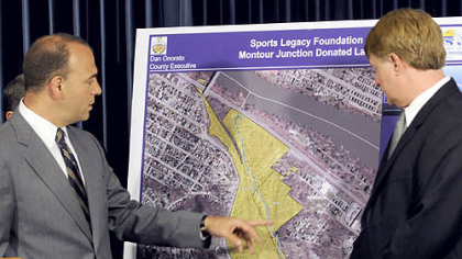 Allegheny County Chief Executive Dan Onorato views a map showing the 78 acres known as Montour Junction, donated by the Sports Legacy Foundation for a new county sports and athletic complex.