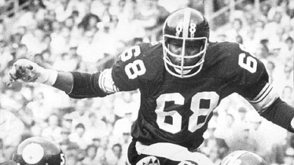 Cleveland quarterback Brian Sipe (17) is sacked for an 8 yard loss by Dwight White (78) and L. C. Greenwood (68) on September 20, 1976 at Three Rivers Stadium.