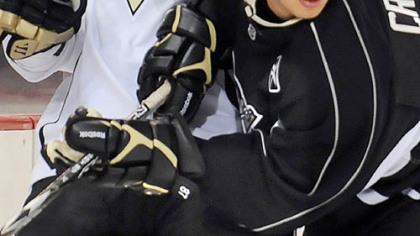 Sidney Crosby, right, battles new teammate Ruslan Fedotenko in practice.