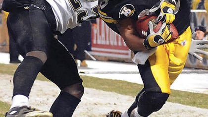 Jacksonville's Reggie Nelson twists around Hines Ward during the pivotal fourth quarter last night at Heinz Field. The Steelers couldn't hold on to a 29-28 lead and wound up losing to the Jaguars, 31-29. (vs. Jaguars 1/5/2008)
