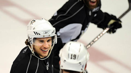 If he was worried after losing Game 1, Penguins center Sidney Crosby didn't show it yesterday at practice as he jokes with Ryan Whitney, in foreground, and Pascal Dupuis.