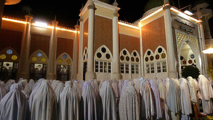 PATTANI, Thailand -- Muslim women pray during Ramadan at the Pattani Central Mosque Monday. The month long observance is normally a festive time of lavish nightly feasts, holiday treats, and family reunions, but it has turned into a more discreet affair in recent years here because many are uneasy leaving home after dark.