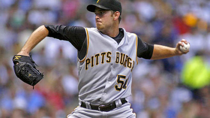 Pirates starting pitcher Zach Duke winds up against the Milwaukee Brewers in the second inning last night.