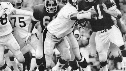Steeler Dwight White stops Vikings' the Dave Osborn in a game during the 1970s.