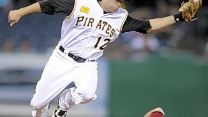 Second baseman Freddy Sanchez goes airborne to snap Ryan Doumit's throw as Houston's Lance Berkman steals second in the fourth inning last night.