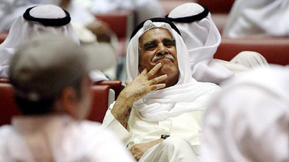 KUWAIT --Traders follow the market's movement as the Kuwait Stock Exchange, the second largest Arab stock exchange, slumped 3.6 percent Tuesday, apparently after the government rejected calls by lawmakers to intervene in the market.