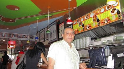 Restaurant owner and friend of Pedro Alvarez's family, Miguel Montas, inside his restaurant El Nuevo Caridad, in Washington Heights, New York City.