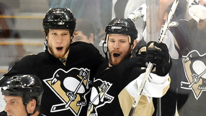 Penguins Jordan Staal celebrates his second period goal with teammate Adam Hall Sunday.