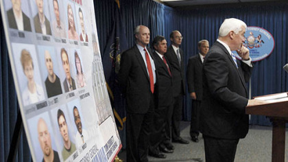 Pennsylvania Attorney General Tom Corbett, right, yesterday announces grand jury presentments in the bonusgate scandal investigation.