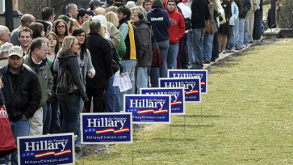 Crowds wait in line for the gym doors to open early Tuesday morning.