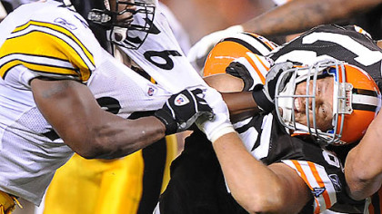 James Harrison stiff arms the Browns' Steve Heiden.