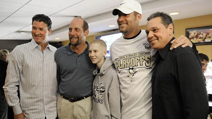 John Challis poses for a photo with Penguins owner Mario Lemieux, Atlanta Braves pitcher John Smoltz, Steelers quarterback Ben Roethlisberger and ex-Penguins star Pierre Larouche during the Penguins game against the Flyers on May 11.