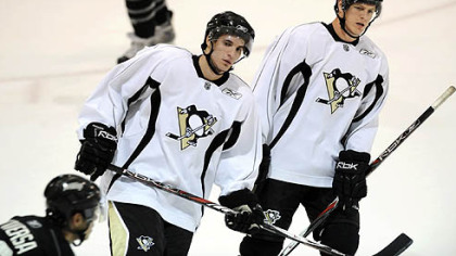 Luca Caputi, left, a fourth-round pick in 2007, practices with the team yesterday at the Iceoplex at Southpointe.