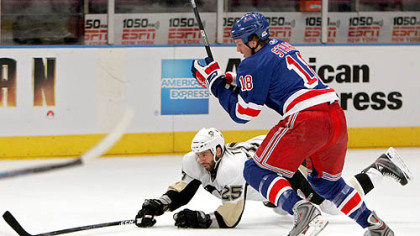 Max Talbot goes to the ice after the puck in Game 3 of the series vs. the Rangers -- the night his foot was broken.