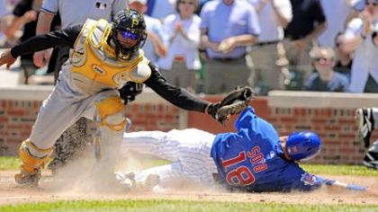 Ronny Paulino tags out Chicago's Geovany Soto at the plate in the third inning, a play that as the game turned out was big in the Pirates' 7-6 win.