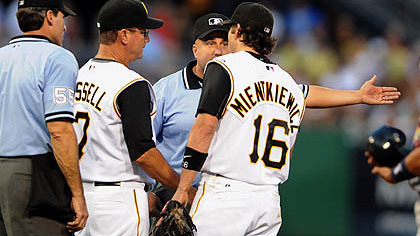 Pirates third baseman Doug Mientkiewicz argues with umpire Eric Cooper after second baseman Luis Rivas put the tag on Cardinals Albert Pujois who was then called safe.