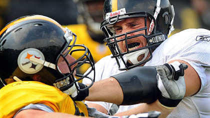 Offensive guard Matt Lentz (right) blocks Kyle Clement.