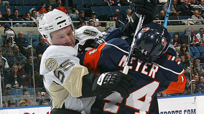 Sergei Gonchar hits the Islanders' Freddy Meyer with his stick last night at the Nassau Coliseum.