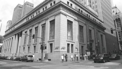 The Lord & Taylor building in 2003, when its closing was announced -- As redevelopment activity buzzes a block away, the building sits empty in the heart of the Downtown retail corridor, its lights off and locked gates blocking the entrances.