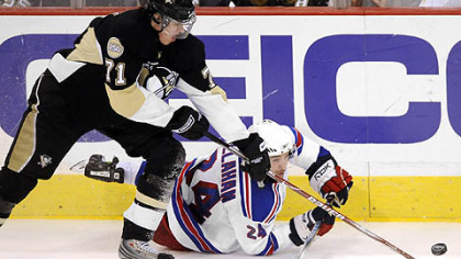 Penguins Evgeni Malkin gets around Rangers Ryan Callahan as he gets a breakaway shot in the second period Sunday.