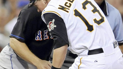Nate McLouth gets caught by the Mets' David Wright between second and third base in the sixth inning last night.