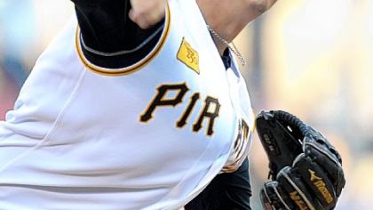 Pirates starter Jeff Karstens delivers in the first inning against the Reds yesterday at PNC Park.