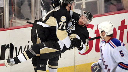 Malkin congratulates teammate Petr Sykora's third-period goal.