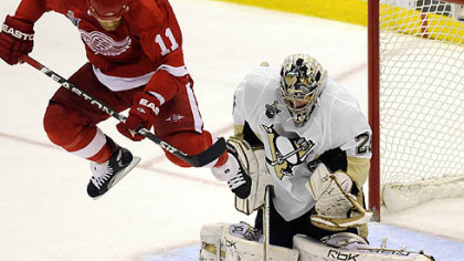 Marc-Andre Fleury makes a save against Red Wings Dan Cleary in the third period.
