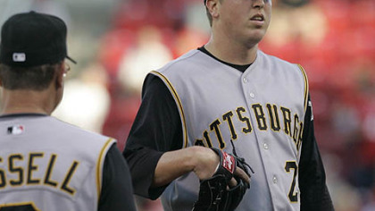 Pirates pitcher Tom Gorzelanny, right, waits to be taken out by manager John Russell in the first inning of last night's game against the Cincinnati Reds.