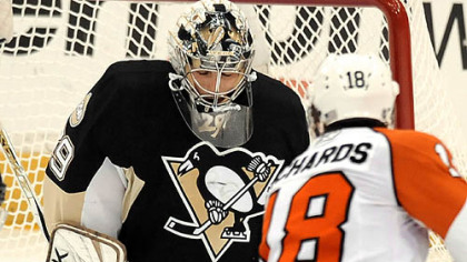 Penguins Marc-Andre Fleury makes a save on Flyers Mike Richards in the first period Sunday.