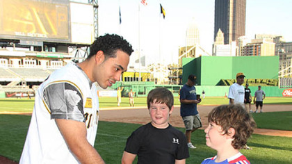 Pedro Alvarez greets children during season ticket holders field day event.