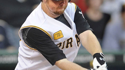 Phil Dumatrait gets a hit in the Pirates' four-run first inning.