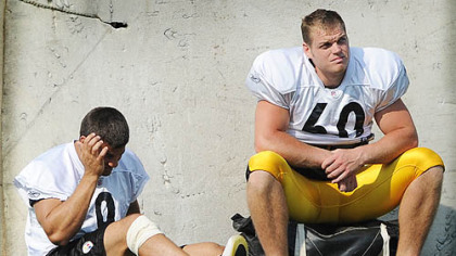 Punter Daniel Sepulveda, left, sits out the afternoon practice at Saint Vincent College yesterday.