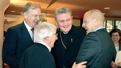 Left to right, Jack McGinley, board chairman, Sister Margaret Hannan, president, Sisters of Mercy, and Bishop David A. Zubik, joke with Jeffrey Romoff, president and CEO of UPMC, after the Celebration of Remembrance, Thanksgiving and Transition ceremony at the Holy Family Chapel at UPMC Mercy.