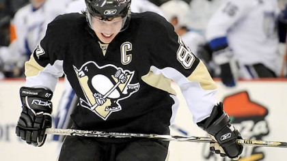Sidney Crosby grimaces after crashing into the boards in the first period, Crosby left the game with a high ankle sprain.