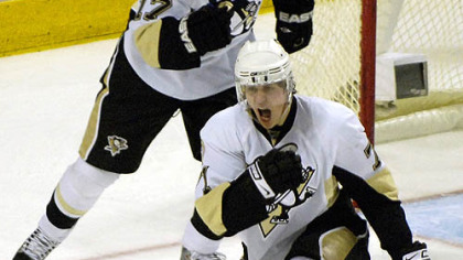 Penguins' Evgeni Malkin, of Russia, right, celebrates his goal with teammate right winger Petr Sykora (17), of the Czech Republic, against the Buffalo Sabres during the third period the game last night in Buffalo, N.Y.
