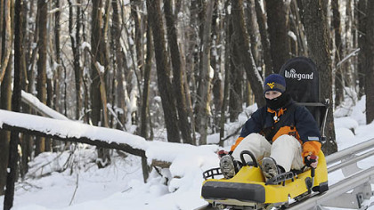 Taylor Myers of Fairmont, W.Va., above, bundles up as she cruises down the Mountain Coaster at Wisp Resort in Garrett County, Md.